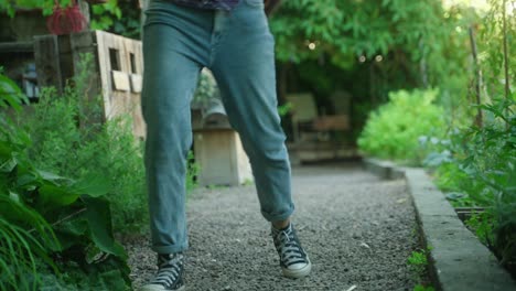 happy woman spins on spot out of joy and dances