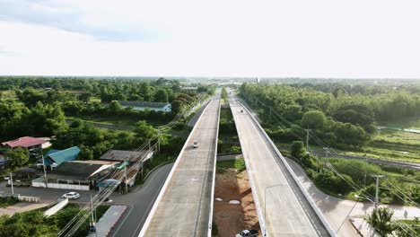 aerial view of parallel elevated roads through green landscape