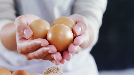 woman holding brown eggs 4k