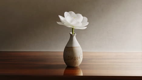 elegant white flower in a rustic vase on a wooden table