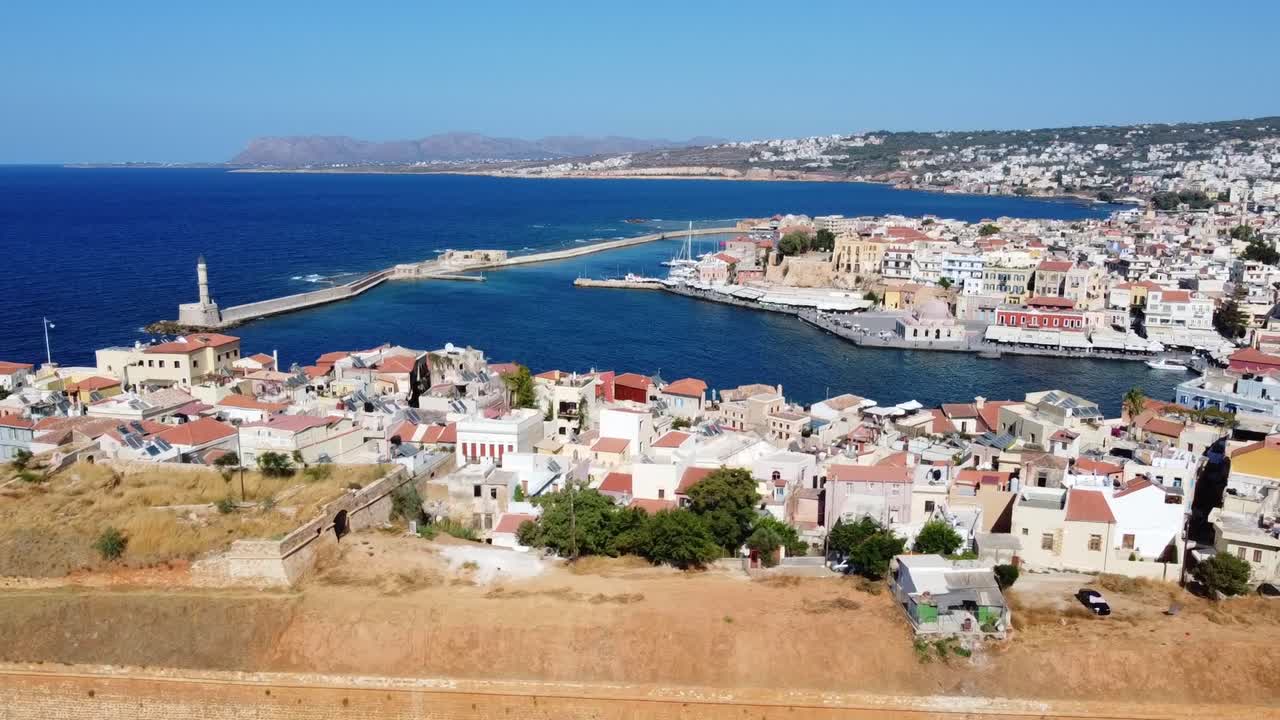 Panoramic aerial view of old Venetian harbor of Chania in create with lighthouse in view, Mediterranean sea