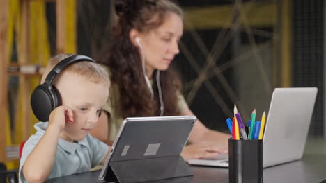 child learning at home with mother