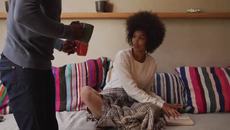 couple drinking coffee in the living room