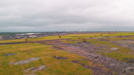 Southeastern Louisiana landfill near New Orleans featuring active gas wells, environmental operations, and overcast conditions.