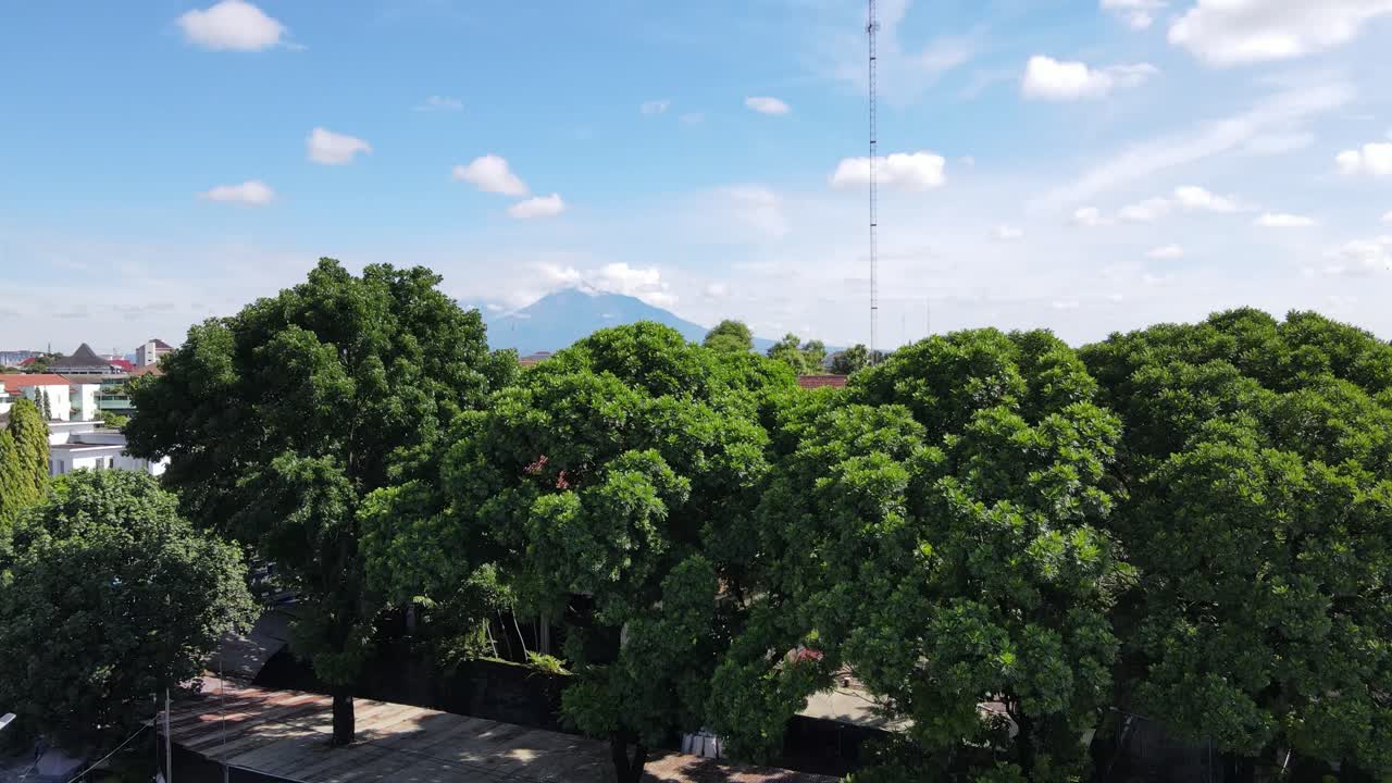 Shooting from the bottom up showing the beautiful volcano and sunny weather in the city of yogyakarta