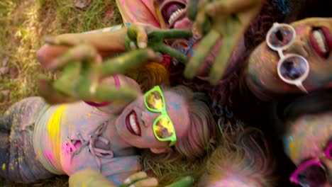 multi-ethnic group celebrating holi festival in park