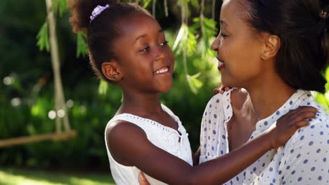 a hug between a mother and her daughter.