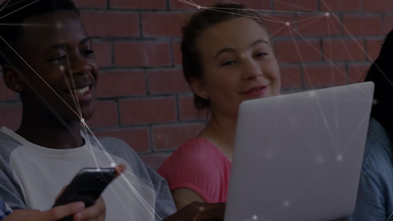 Animation of network of connections over diverse students using laptop