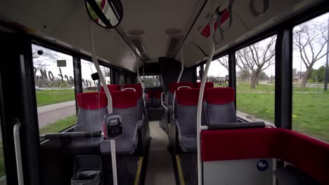 an empty public bus in eindhoven, netherlands during the corona virus infection - wide shot