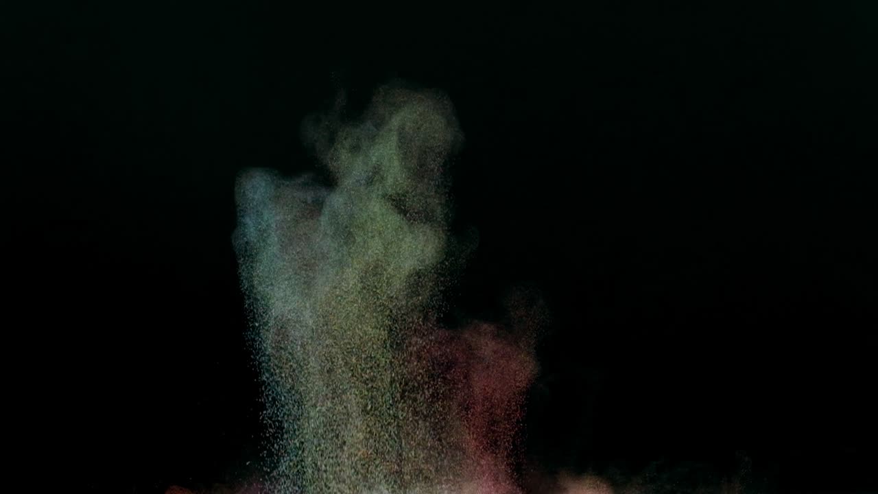 el salpico colorido de pequeñas partículas en cámara lenta