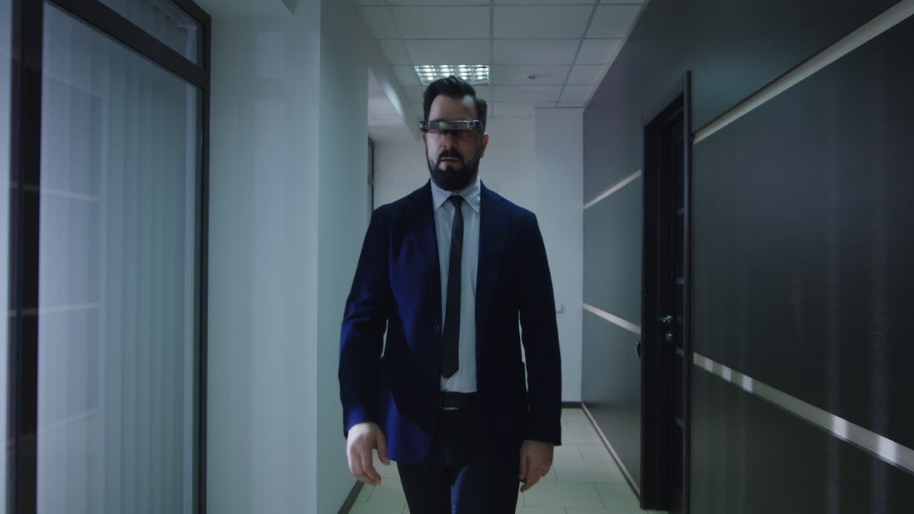 Businessman in Augmented Reality Glasses in Office Corridor