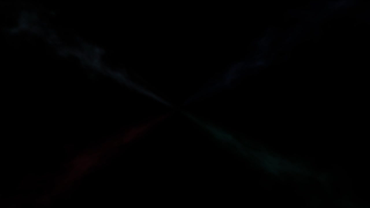 4 개의 빠른 색의 연기가 검은색에 대항하여 중앙에서 움직입니다.