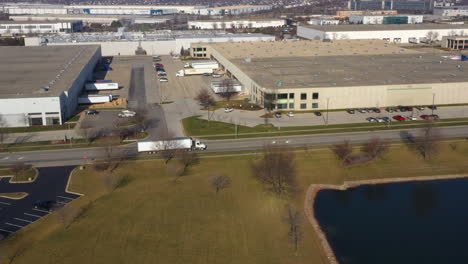 heavy goods transport by tractor trailers in chicago logistics area, tracking shot