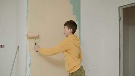 boy painting a wall