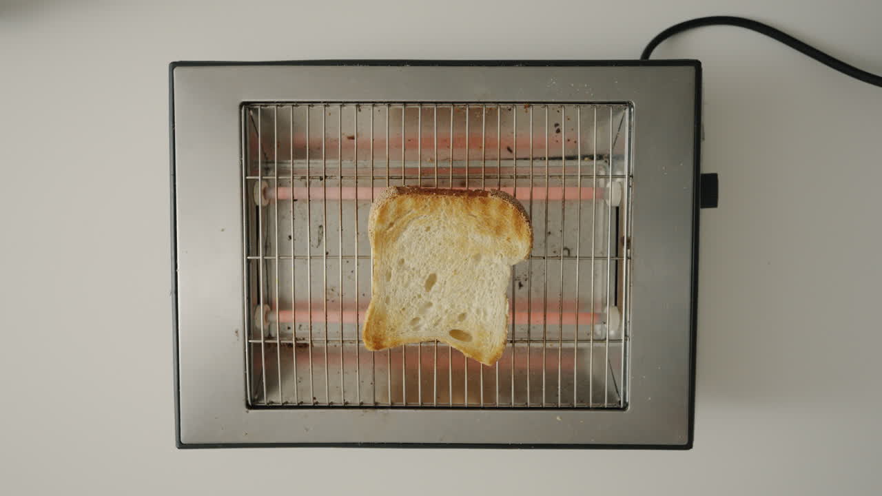 Retro toaster toasting toast top shot 4K