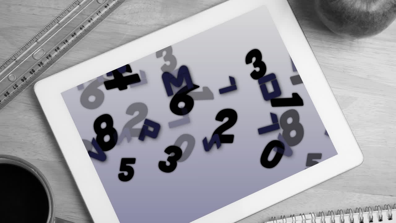Digital animation of multiple numbers and alphabets on screen on digital tablet on wooden surface