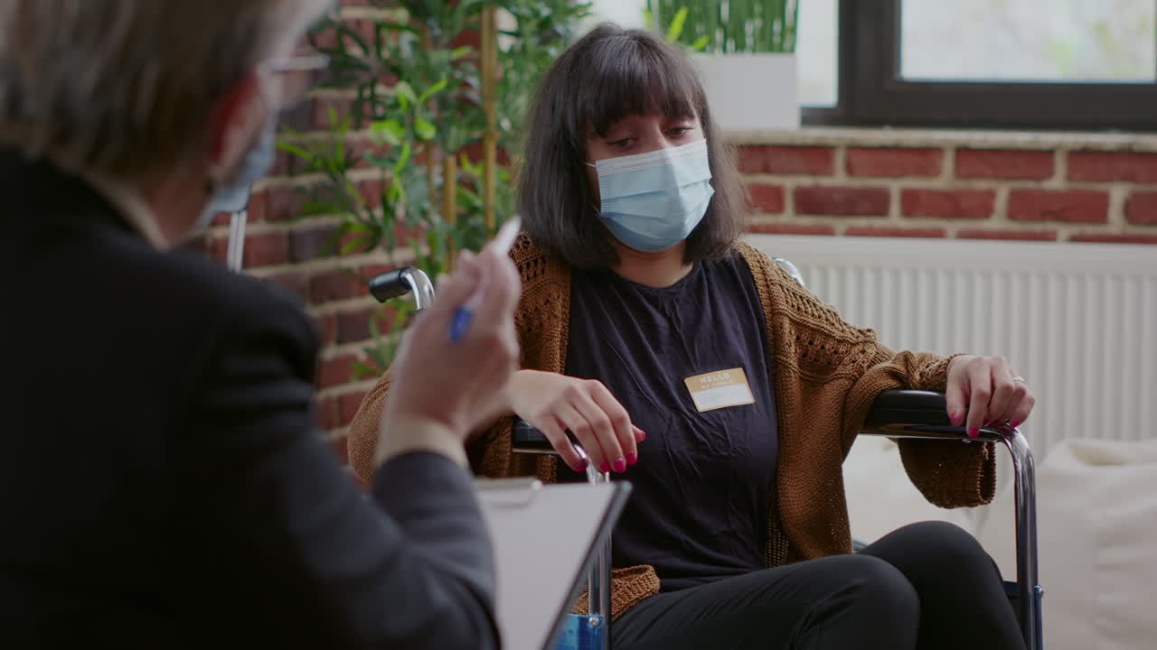 Close up of woman with physical disability talking about addiction and depression at aa meeting