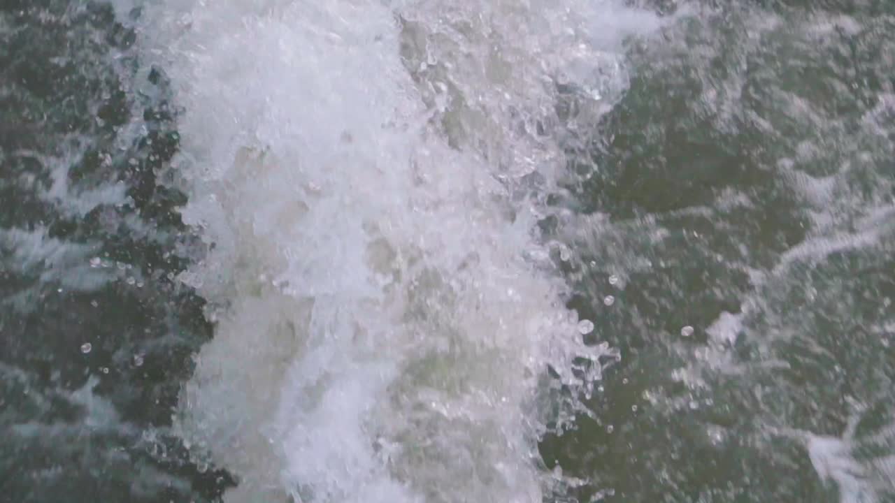 The backwash of a fast boat on the open ocean or lake