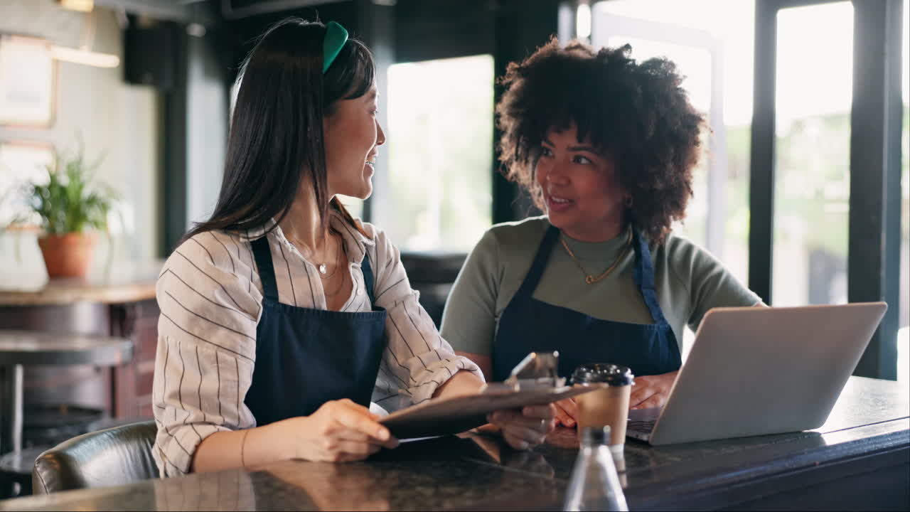 Two Women Baristas in a Cafe