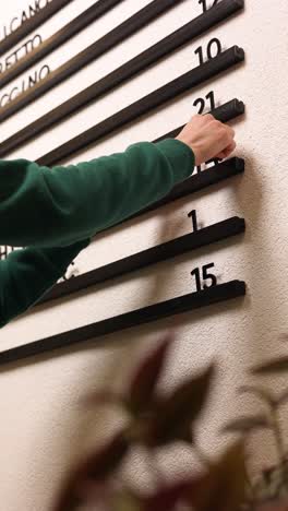 person selecting a table number