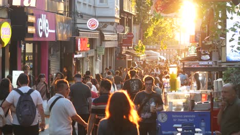 busy street scene in a city at sunset