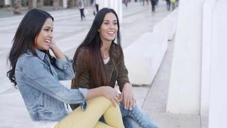 two trendy young women relaxing