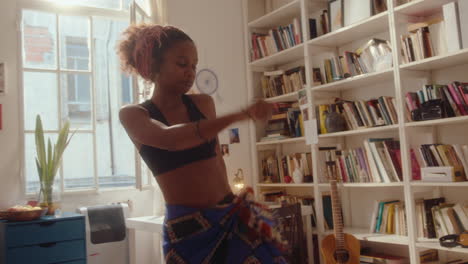 vibey black girl dancing in room on sunny day