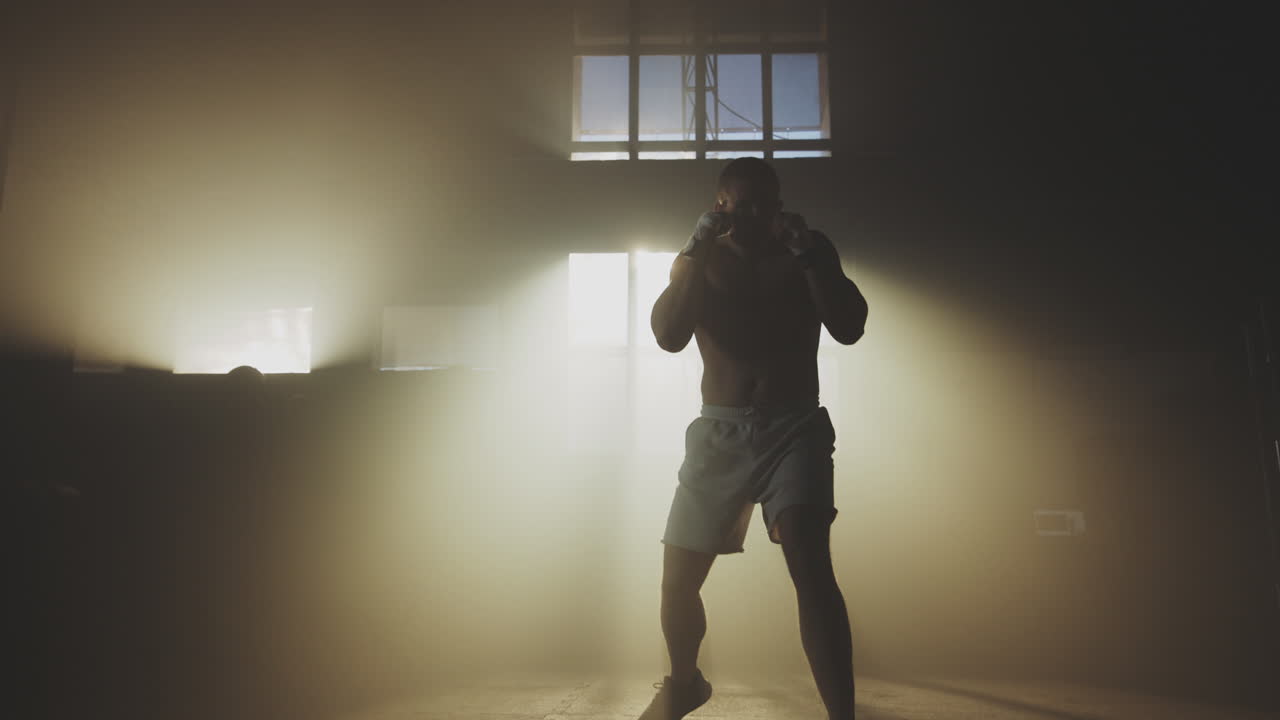 Male Boxer Training in a Gym