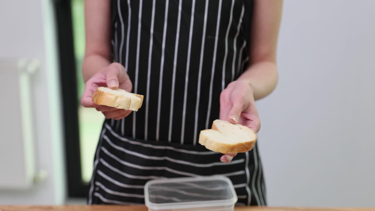 Woman preparing a sandwich