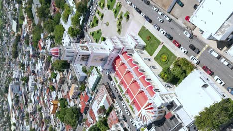 White-sacred-Heart-of-Jesus-Church-city-Moca,-portrait-aerial-on-a-sunny-day