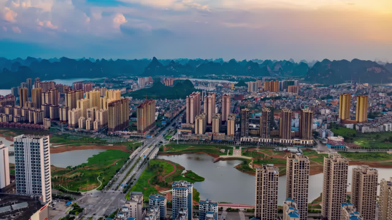 View Of Car Traffic On Cross Road And Highway Intersection In Modern City With Skyline Skyscrapers Landmark Building Under Blue Sky, Bridge Time-lapse Video