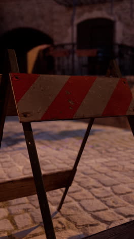 old weathered roadblock at night