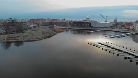 Aerial-view-over-Karlskrona,-Sweden-showing-parts-of-the-city-and-the-ocean-its-connected-to-1