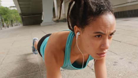 front view of young african american woman exercising in the city 4k