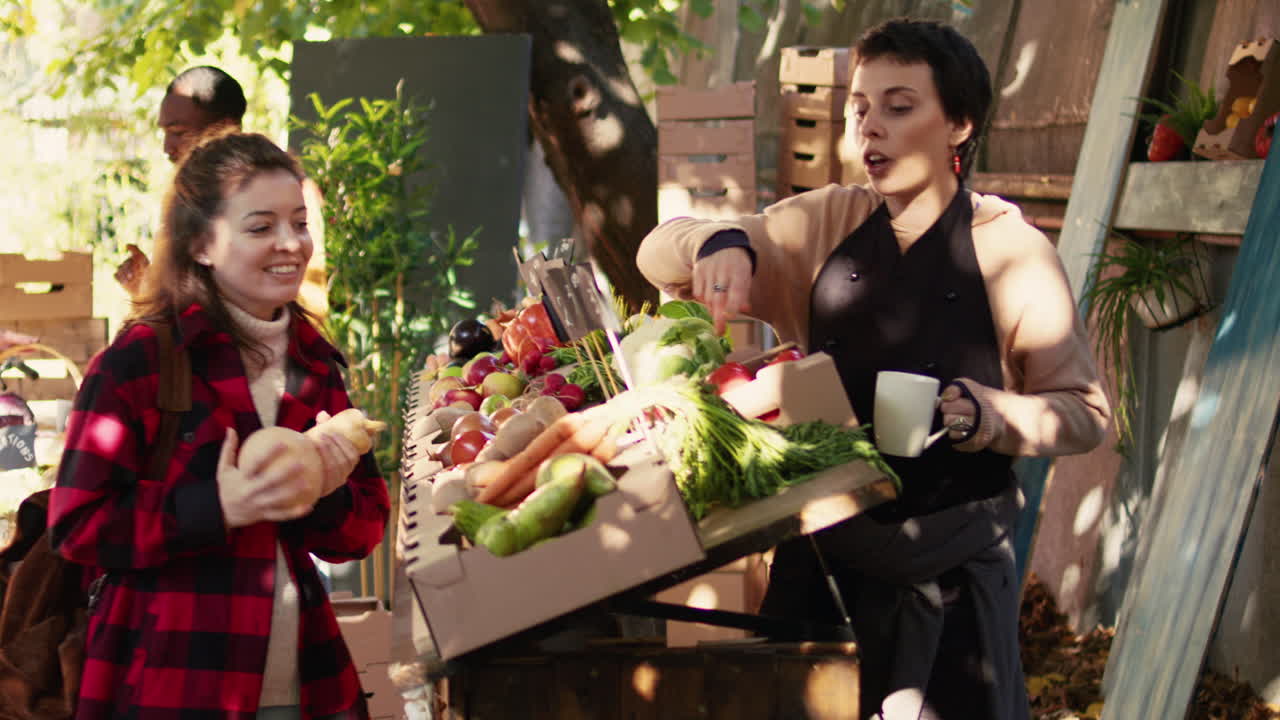 People buying fresh produce at an outdoor market stall