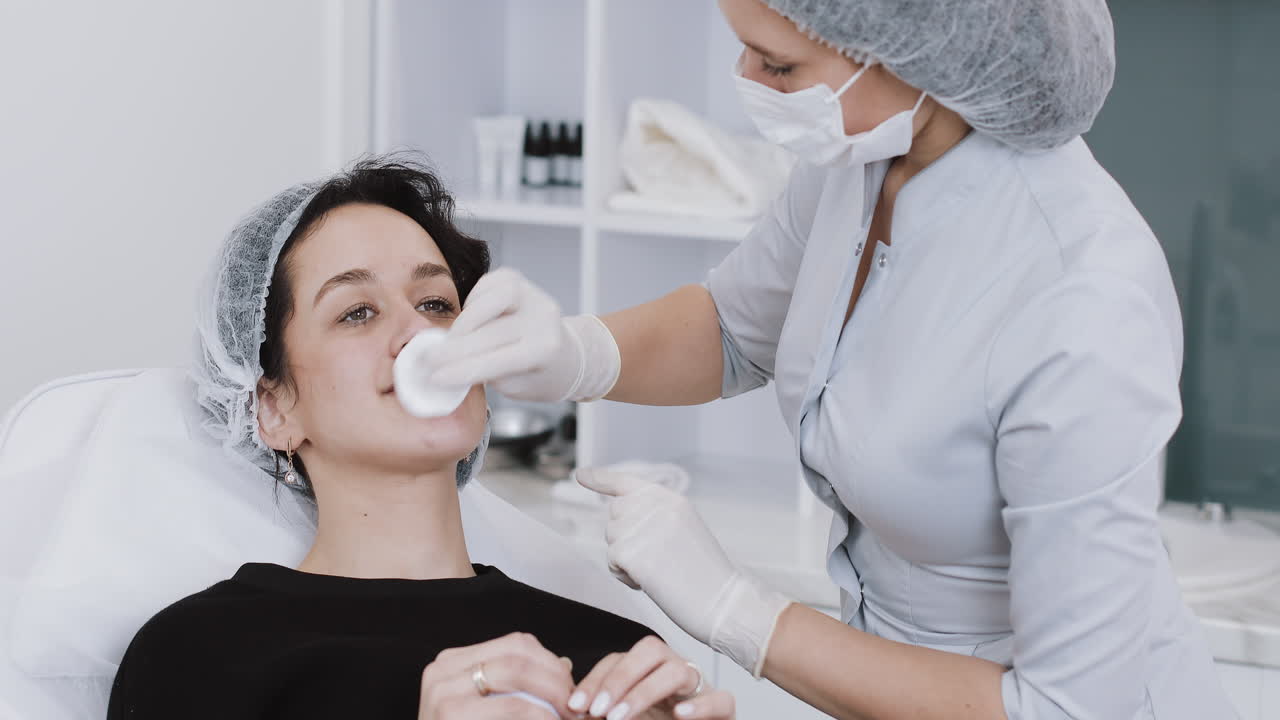 Woman receiving cosmetic procedure at beauty clinic