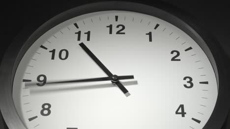 clock face in time lapse on dark grey wall