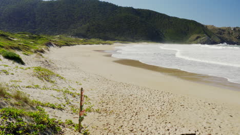 establishing shot of lagoinha do leste beach sign, florianopolis, santa catarina, brasil