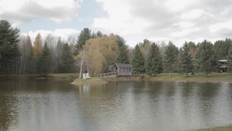 beautiful scenic landscape with a pond that has a island in the middle of it at bean town ranch near ottawa