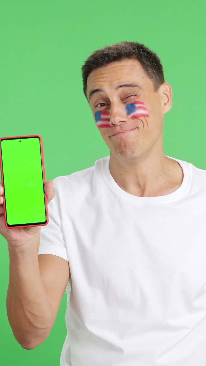 USA man looking at his mobile smiling and showing it