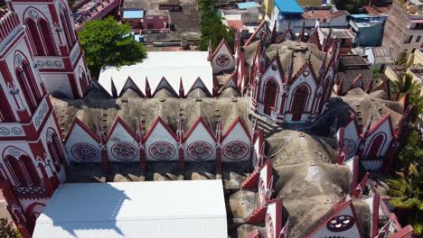 Drone-shot-of-Basilica-of-the-Sacred-Heart-of-Jesus,-situated-on-the-south-boulevard-of-Pondicherry-in-Puducherry,-India,-is-an-oriental-specimen-of-Gothic-architecture