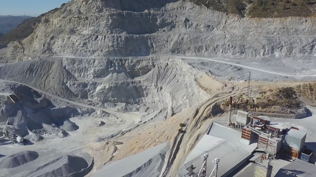 Aerial close view of a big quarry in a mountain