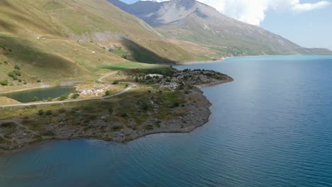 aerial view of a serene mountain lake and alpine landscape