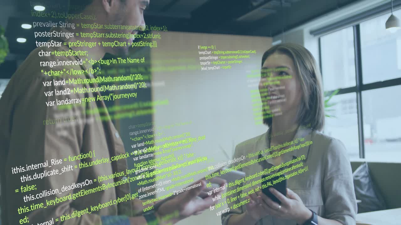 Engineers tapping tablet while reading code on phone by window showing green overlay and fixing bug