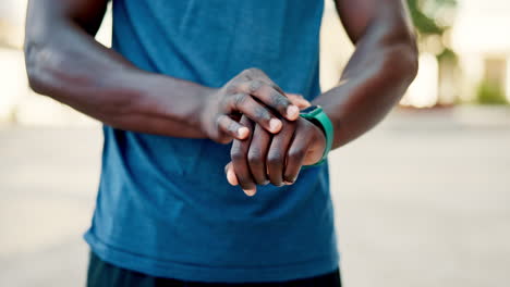 man checking smartwatch during workout