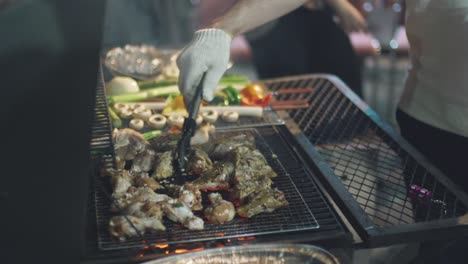 variety of meats and vegetables being barbecued on the griller