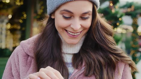 Handheld-view-of-woman-opening-Christmas-gift