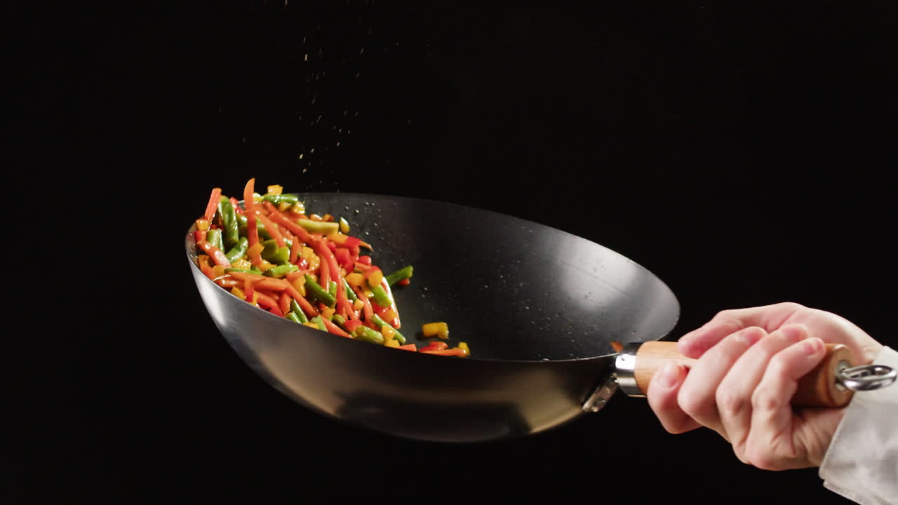 Chef Stir-Frying Vegetables in a Wok