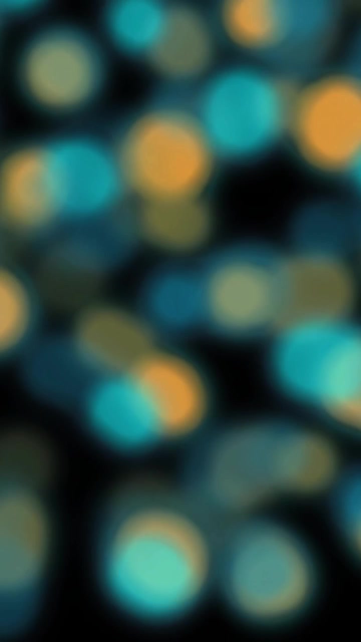 Animazione di punti luce arancioni e blu sfocati e lampeggianti su sfondo nero