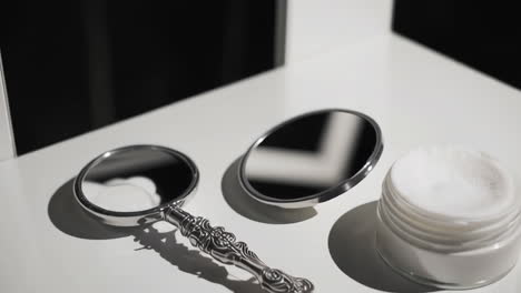 close-up of skincare cream in glass jar